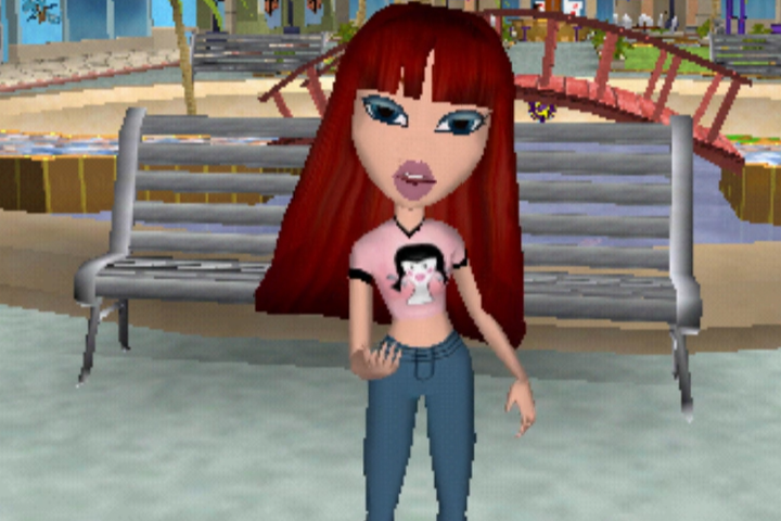 Phoebe has long deep red hair and pale skin. She wears a cropped baby pink shirt with a doll face with black braids on the front and light blue jeans. Her eyes are blue.